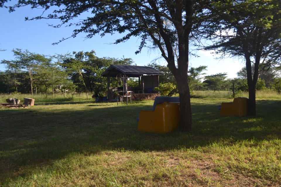 An outdoor washbasin area on the camp lawn.